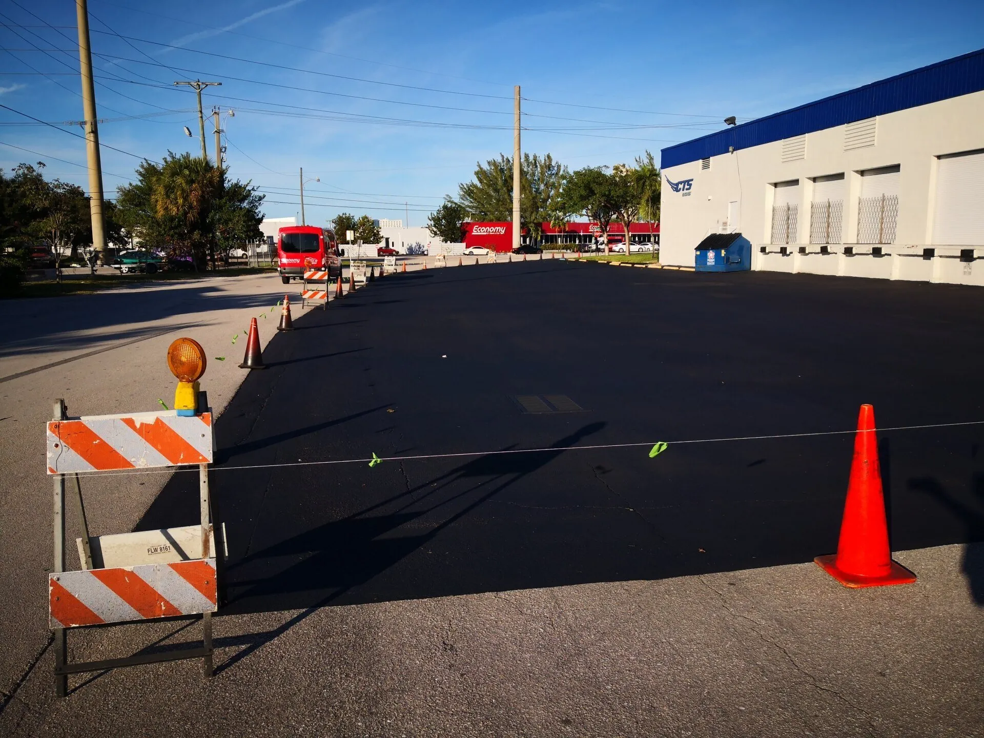 freshly sealcoating commercial parking lot in Jacksonville FL